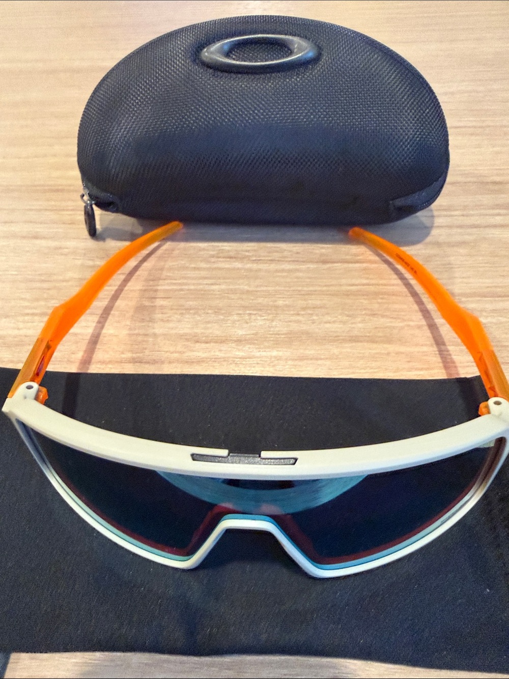 Oakley Wrap Sunglasses White Frame with Orange Temples and Dark Lenses